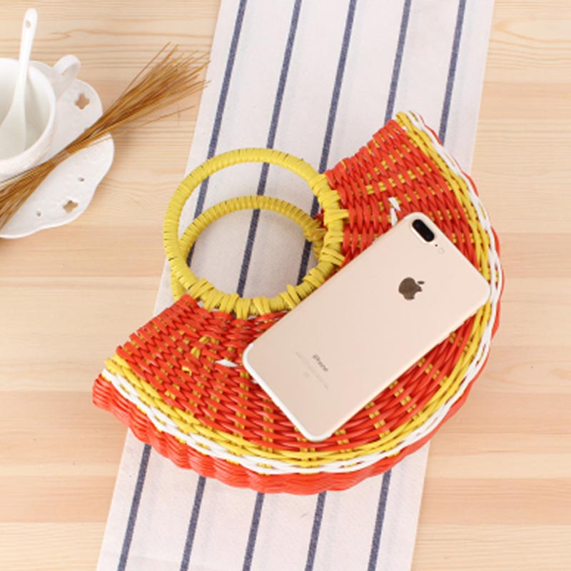 Colorful fruit handbag in cute semi-circular shape. Handmade PVC woven beach straw bag